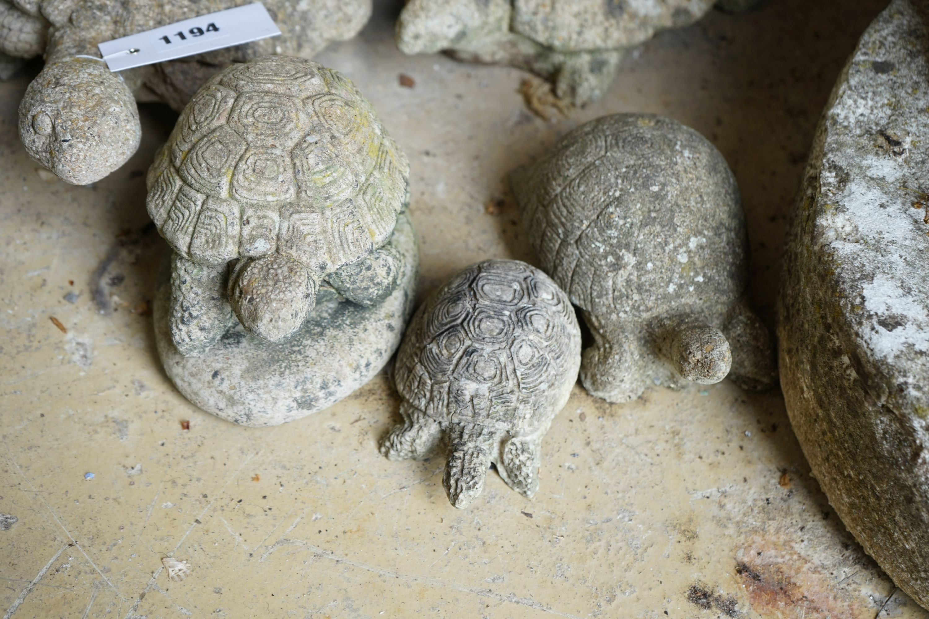 Five reconstituted stone tortoise garden ornaments, largest length 28cm